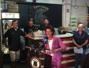 Gov. Gina M. Raimondo at the signing ceremony on September 10 at Ravenous Brewing Company in Woonsocket. The new law allows breweries and distilleries to sell limited amounts of their products to visitors for sampling and off-site consumption. 