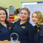 BevMax employees, Claudia Castillo, Laura Garcia and Danica Wilhowy, preparing to welcome guests at the new Danbury store.