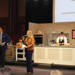 Ryan Kristafer and Laurie Foster served as the event’s emcees during the Saturday Grand Tasting. Celebrity Chef William Koval prepares a spiced duck breast during a demonstration.