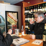 Osman with Patrick Misciagna, Owner, Greenfield Liquor Shop. Misciagna said many of his customers drink Manhattans and Old Fashioneds, to which KAS Krupnikas can be added for a unique twist on those classics. Misciagna arranged an in-store tasting of the product to show his customers.