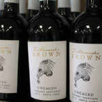 Z. Alexander Brown Wines at Hartley and Parker Limited. Each bottle is packaged with the word “uncaged,” along with an owl taking flight to show the “intense, full-bodied expressions” of the wine.