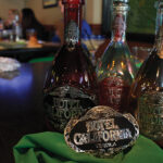 Hotel California Tequila bottles and the grand prize belt buckle. Each bartender had seven minutes to craft a cocktail using Hotel California Tequila.