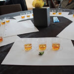 Tasting sample of Bulleit 10, Bulleit Rye, and Bulleit Bourbon Whiskey with a mint leaf.