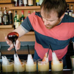 Ryan Kennedy, Bar Manager, Cook & Brown creating cocktails.