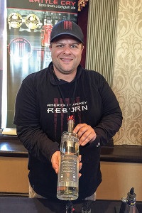 Sons of Liberty Spirits Company Owner Michael Reppucci with True Born Gin.