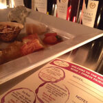 Milk & Honey cheese platters sampling with Newport Vineyards wines in the background.