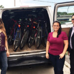 Project Broken Wheel Volunteers delivering bikes to Praise Tabernacle’s Live Out Loud Program. Maegan Tikiryan, Alaina Bart and Frank Martucci.