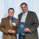 Volunteer of the Year George McAuliffe of Mews Tavern with Sculos.