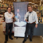 Alex Di Zenzo holding Guardia 33 Aglianco and Ken Roeder holding Guardia 33 Falaghina, both floor managers at Norwalk’s Liquor Mart.