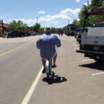 Rogo’s General Manager Clem Sayers rides into downtown Fort Collins on a New Belgium-provided bike.