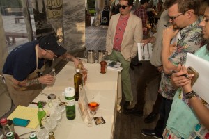 Roth presenting his cocktail to the judges.