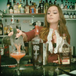 Stephanie Merola of The Dorrance pouring her cocktail.