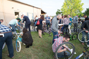 Visiting bartenders at the Providence-hosted USBG National Leadership Conference took time to help refurbish bikes for Project Broken Wheel. Photo by Chris Almeida.