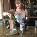 Bartender Willa Van Nostrand mixes up a “Dandy Lion” cocktail at The Chanler, Newport.