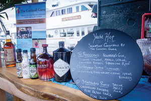 A Yacht Hop cocktail menu with selection showcasing Hendricks Gin, Solerno Liqueur, Glenfiddich and Sailor Jerry Rum.