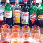 The portfolio lineup featuring Aperol, Campari, Cinzano 1757, Averna, Braulio, Cynar, Cynar 70 and Frangelico.