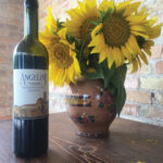 A display of sunflowers, which are grown on the Angelini property, with Angelini Estate Sangiovese DOC Riserva.