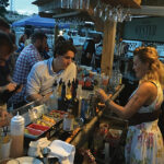 Competitor Danielle Riley of the Bristol Oyster Bar mixes up her cocktail as Judges Ian Magiros, On-Premise Key Account Specialist, M.S. Walker and Justin Sullivan, Assistant General Manager, M.S. Walker, look on.