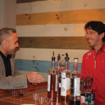 David Rossi, Co-owner Waypoint Spirits behind the bar conducting a tasting for Chris Camberi, Co-owner, Willowbrook Spirit Shoppe.