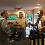 Baracchi speaks with guests at a wine class at Divine Wine Emporium in Niantic.