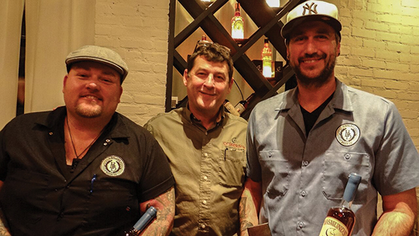 Winning team Corey Bonderenko and Roger Gross of Highland Brass Co. with Rick Wasmund (center), Owner, Copper Fox Distillery. The winning cocktail, called “The Perfect Sperryville Marconi,” was made with 1.5 oz. Copper Fox Rye, 1 oz. Carpano Bianco, 1/2 oz. Fruits Rouges, 3/4 oz. lemon juice, 1/4 oz. simple syrup, Molasses bitters and Martinelli’s Sparkling Cider.