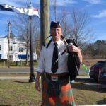 The bagpipe player in front of Empire Wine and Liquor played traditional Irish hymns for customers.