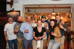 John Begin, Event Emcee; John Edgell, Competitor; Benny Barber, Competitor; Bronya Shillo, Founder, Fishers Island Lemonade; Jen Galyon, Competitor and Third Place Winner; Tyler Bernadya, Competitor and First Place Winner; Mike Dusiewiez, Sales Manager, Fishers Island Lemonade; Briana Trudell, Competitor; Brian Hewitt, Competitor and Second Place Winner.