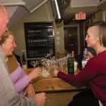 Kelly McCarthy, Brand Development Manager, Anchor Distilling Co. with guests.