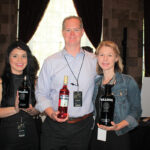 Mya Scott, Promotions; Gary Dritschler, State Manager CT/RI, Campari America; and Candice Dritschler, showcasing Campari and Bulldog Gin.