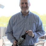 Brett Powell, Constellation Brands, holding Ravage Cabernet Sauvignon 2015 of California.