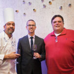 Hotel Viking Executive Chef Barry Correia; Matt Hobbs, Winemaker, Paul Hobbs Winery, next to a consumer and guest during the Hotel Viking wine dinner. Photo by Meagan Emilia Photography.