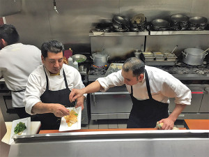 Bistro Mediterranean Norwalk staff puts the finishing touches on slow-poached red snapper over white rice with cherry tomato, pearl onion, and oregano. This dish was paired with Vanidade Albariño, a white varietal native to Galicia.