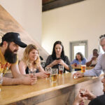 Joseph Ianaire enjoying samples of Narragansett beers with Narragansett employees at the Isle Brewers Guild.