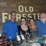 All from J. Timothy’s Taverne: Sean Murphy, Manager; Lauren Hansen, Bartender and Supervisor; Marrit Budny, Bartender and Supervisor; Tim Adams Co-owner, beside the Old Forester sign and tasting table.