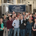 The Johnson Brothers, Inc. sales team featuring Justin Gargano, Founder and President of Thimble Island Brewing Co. (center left) and Keith Miranda, President, Johnson Brothers of Rhode Island (center right).