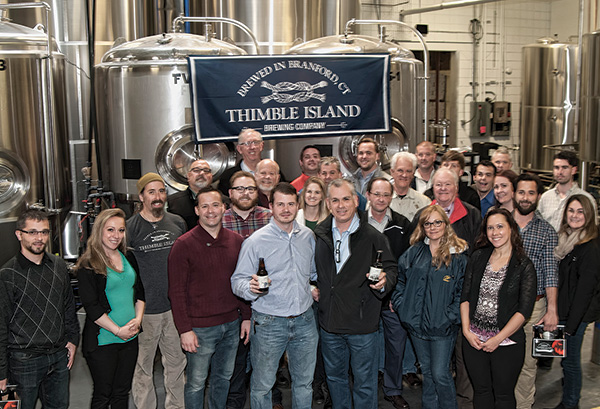 The Johnson Brothers, Inc. sales team featuring Justin Gargano, Founder and President of Thimble Island Brewing Co. (center left) and Keith Miranda, President, Johnson Brothers of Rhode Island (center right).