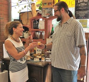 Cordelli talks with a guest at Val’s Putnam Wine in Greenwich.