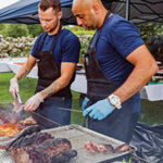 Chef Antonio Franco of Basta searing the meat with Paulo Jalaf on July 25. 