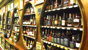 Whiskey fills three barrel-shaped shelf areas at Lowery’s in Sunnyside, Queens.