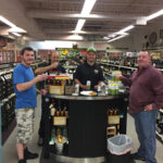 Jeff Gaurdreau, Sales, Liquid Assets Fine Wine & Spirits (center) surrounded by fans of Newport Storm while promoting the latest release Rhode Trip on June 23.