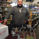 Matthew Barry, Sales Representative, Northeast Beverage Corp., presenting Ozone Vodka at Gordon’s Yellow Front Wines in New London.