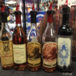 Portfolio of 10, 12, 15, and 20 year-old Pappy Van Winkle whiskies and the Southern Belle Red Blend, aged in old Pappy Van Winkle barrels.