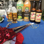 Table display during Pogash’s guest appearance on “The Rhode Show,” celebrating the Fourth of July with cocktails featuring Newport Storm Beer and Solerno Liqueur among ideas.