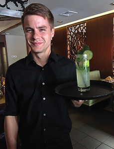 Server Randall Pietsch and Nami's Cucumber Sake Mojito.