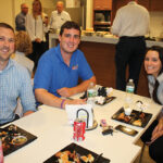 Rhode Island Distributing Company’s Kyle Grudzien, Michael Pauchspies and Brittany Amaral.