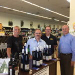 Kevin Visocchi, Store Manager, Amity Wine & Spirits; Michael Schlink, President, Schlink Haus; Roy Hannon, General Manager, Amity Wine & Spirits; Dan Hogan, East Region Manager, Wein-bauer, on July 5 during an in-store tasting and bottle signing at Amity Wine & Spirits in New Haven.