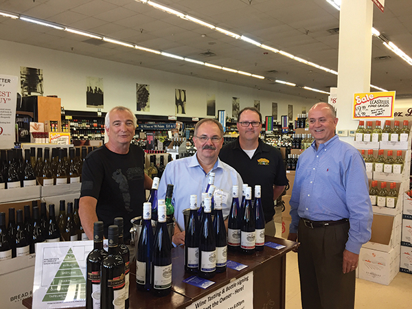 Kevin Visocchi, Store Manager, Amity Wine & Spirits; Michael Schlink, President, Schlink Haus; Roy Hannon, General Manager, Amity Wine & Spirits; Dan Hogan, East Region Manager, Wein-bauer, on July 5 during an in-store tasting and bottle signing at Amity Wine & Spirits in New Haven.