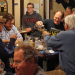 Dave Robertson, Owner, Scottish Dave’s Pub, pouring Scotch tastes for guests.