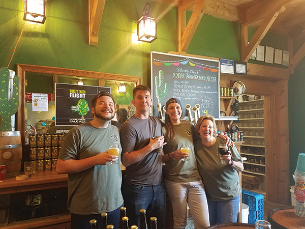 All from Shebeen Brewing Company during its Fourth Anniversary Fiesta on May 6. Nick Renna, Taproom Manager; Shane Lawrence, Taproom Staff; Alyssa Dombroski, Marketing and Events Coordinator; and Cory Lowry, Taproom Staff.