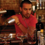 Marco Meza, Bartender, The Black Sheep mixing up cocktails during the event.